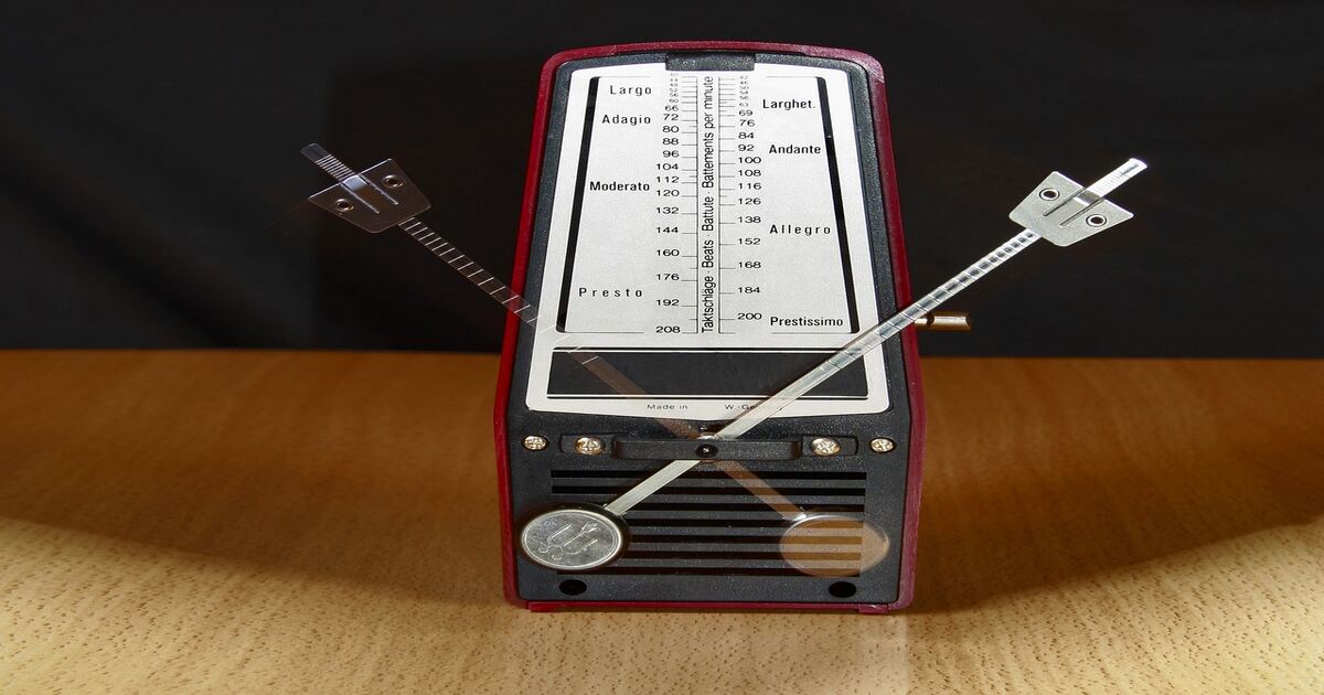 An image of a mechanical guitar metronome. 